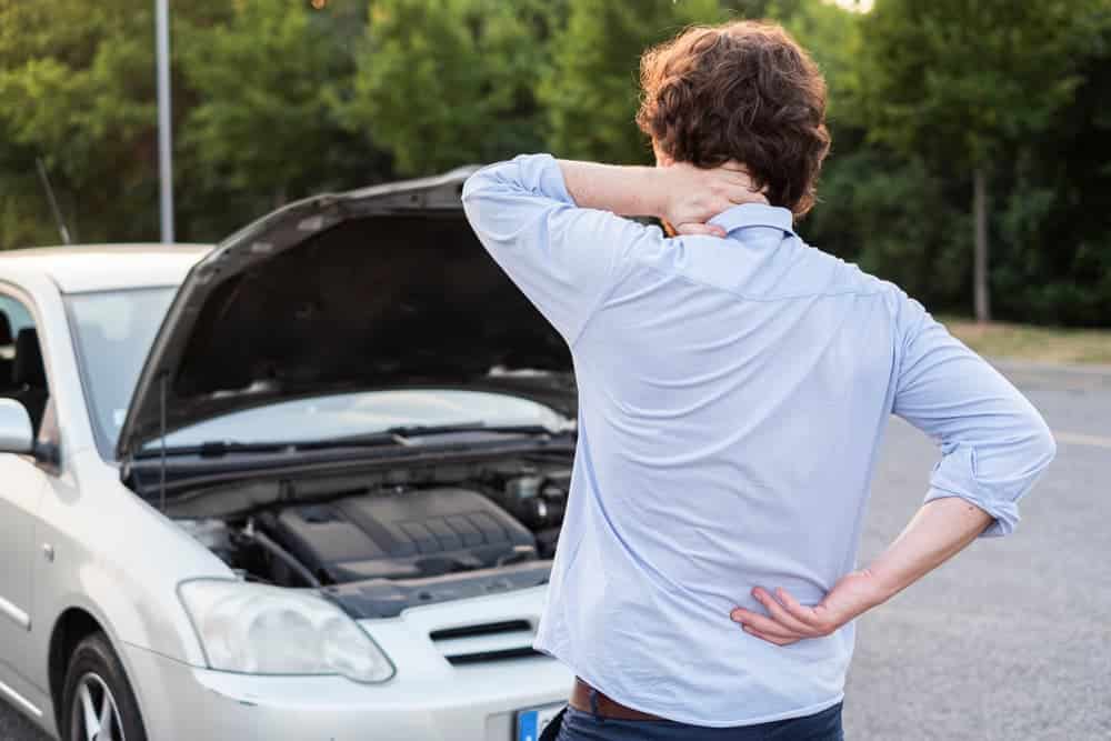 Man suffering from back and neck injury after car accident